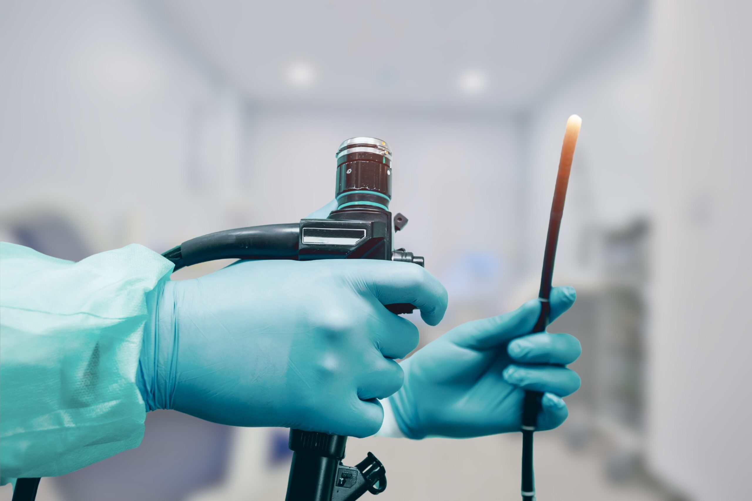 AI-enabled endoscopy device and monitor in a procedure room.